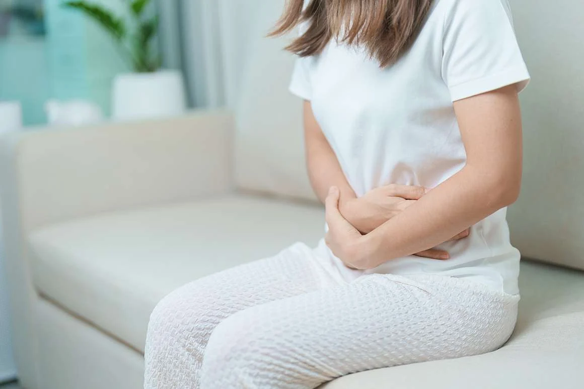 Woman with stomach pain from an imbalanced gut